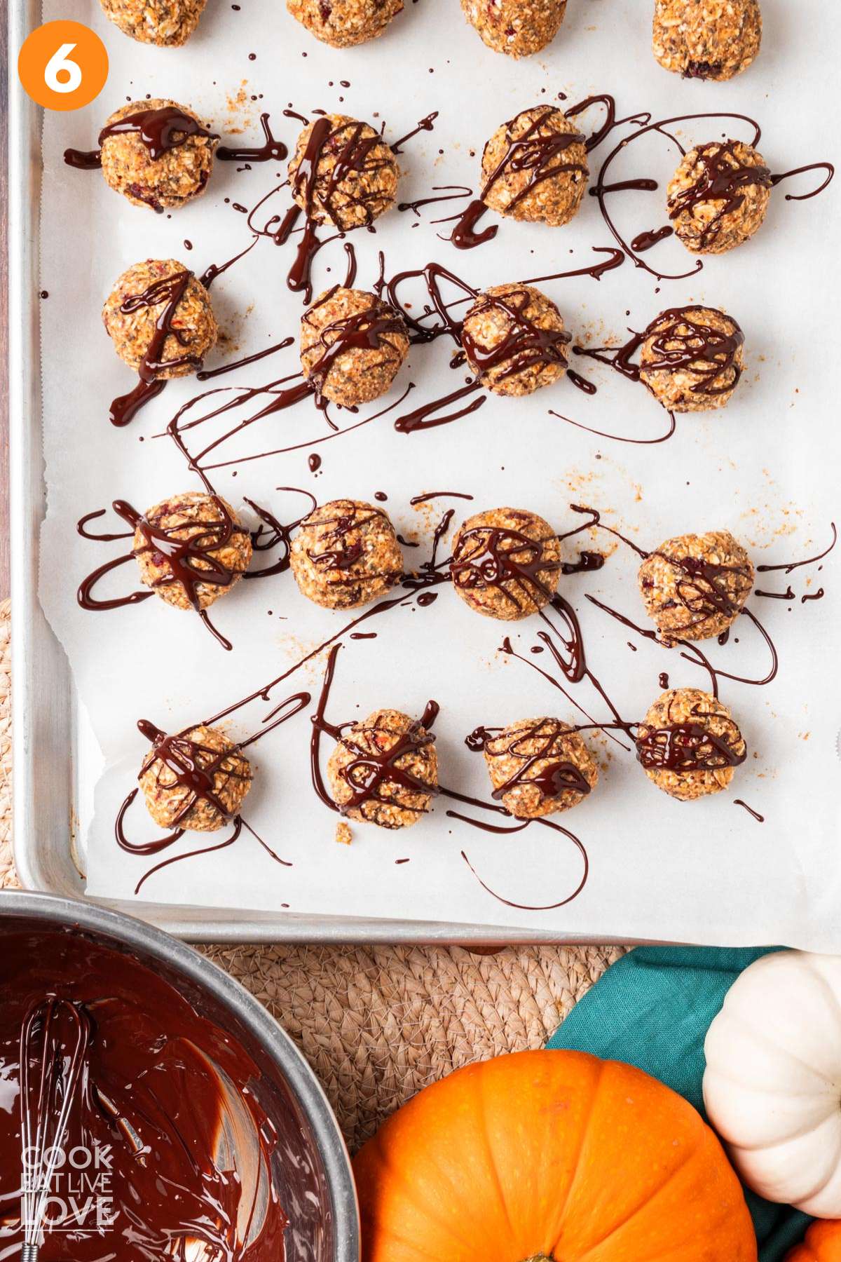 Pumpkin energy bites drizzled with chocolate.