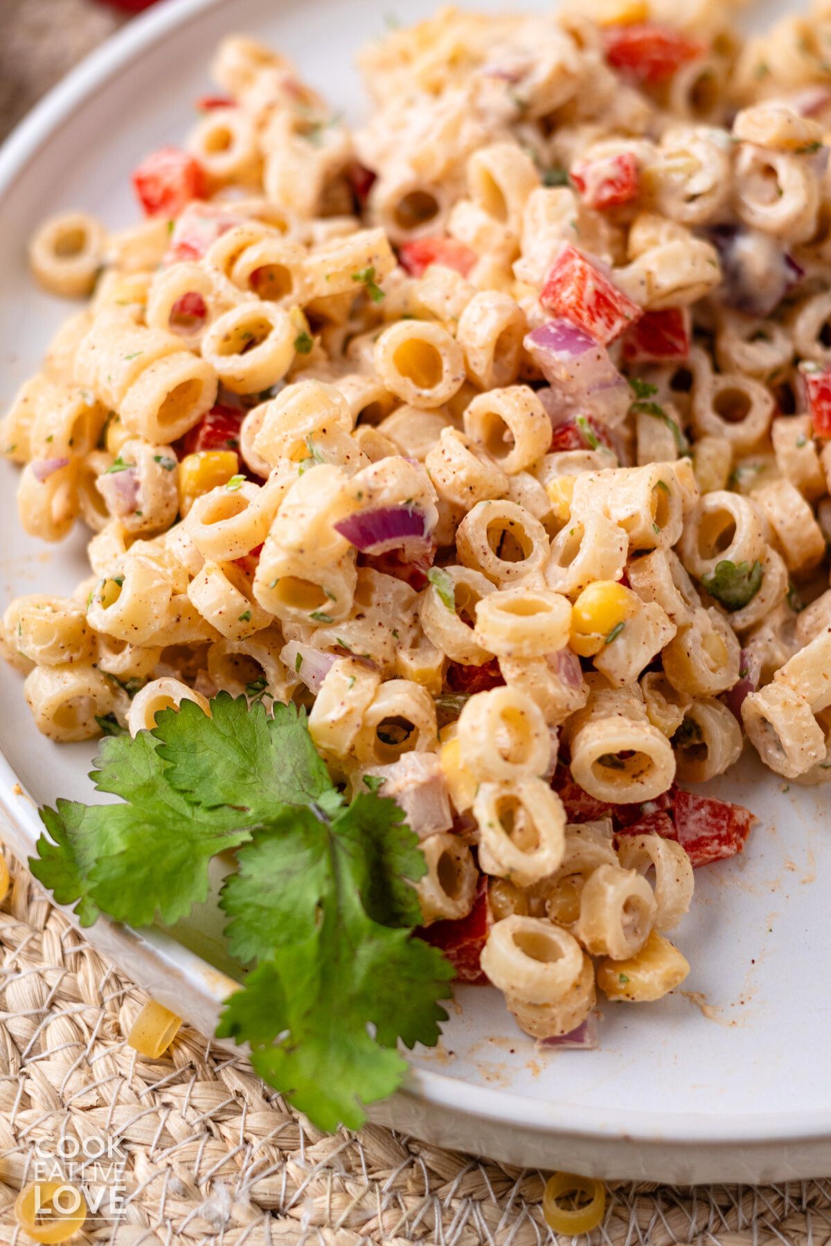 Mexican macaroni salad on a plate garnished with cilantro.