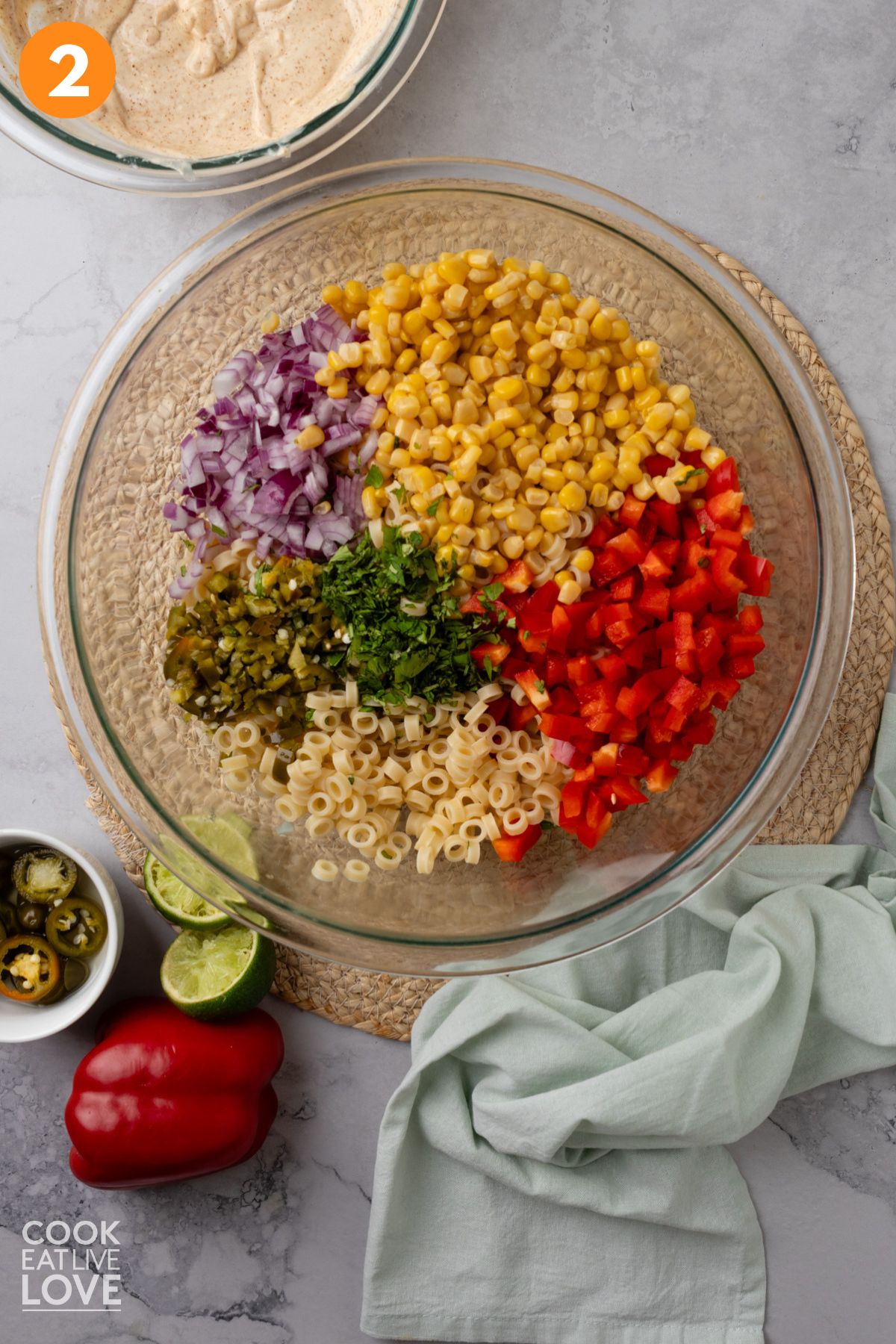 Pasta and vegetables for Mexican pasta salad in a bowl.