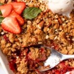Pin for pinterest graphic with image of strawberry crumble and text on top.