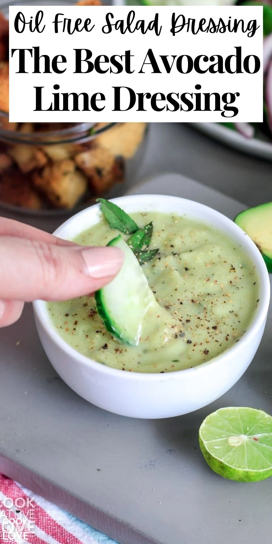 Pin for pinterest with image of avocado dressing in a bowl and text on top.
