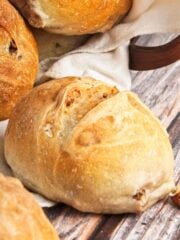 Dinner rolls on a wooden table.