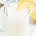 Pin for pinterest graphic with image of coconut lemonade and text on top.