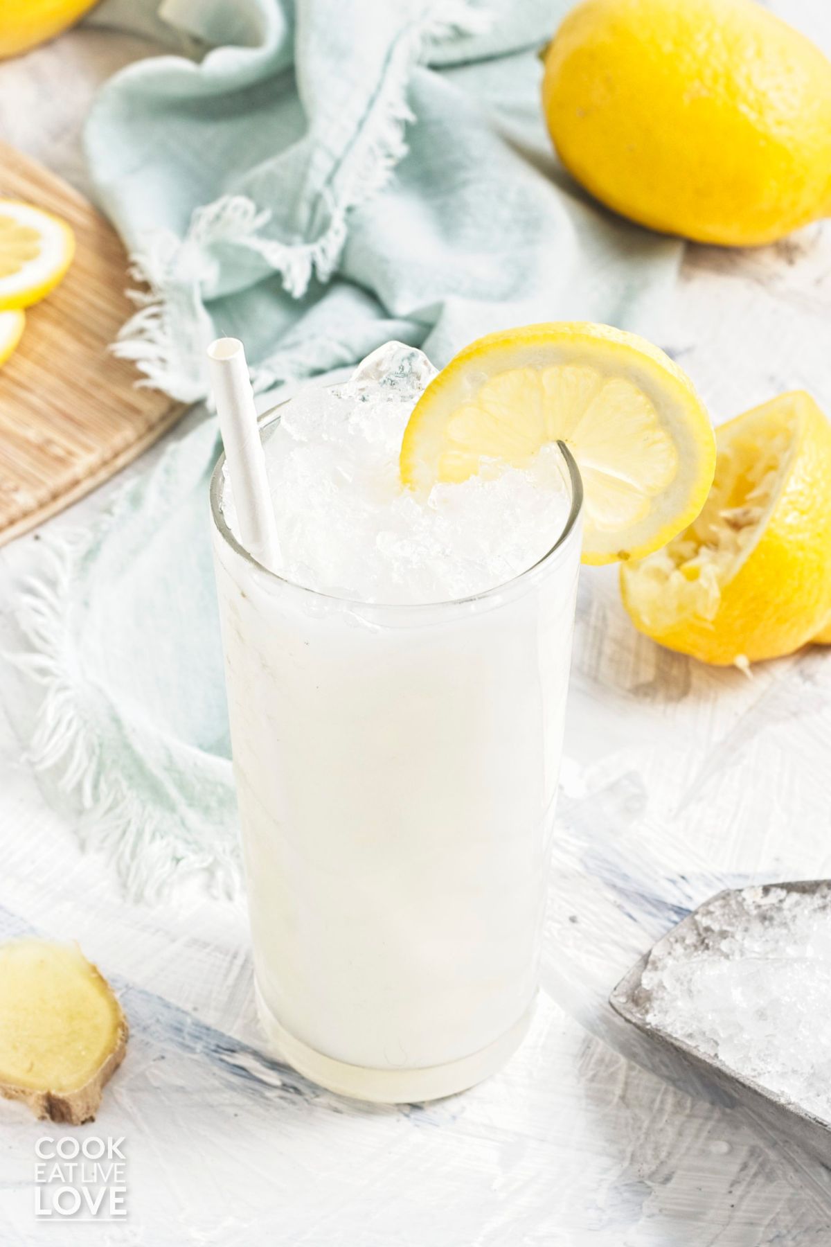 Creamy coconut lemonade poured over ice in a glass.