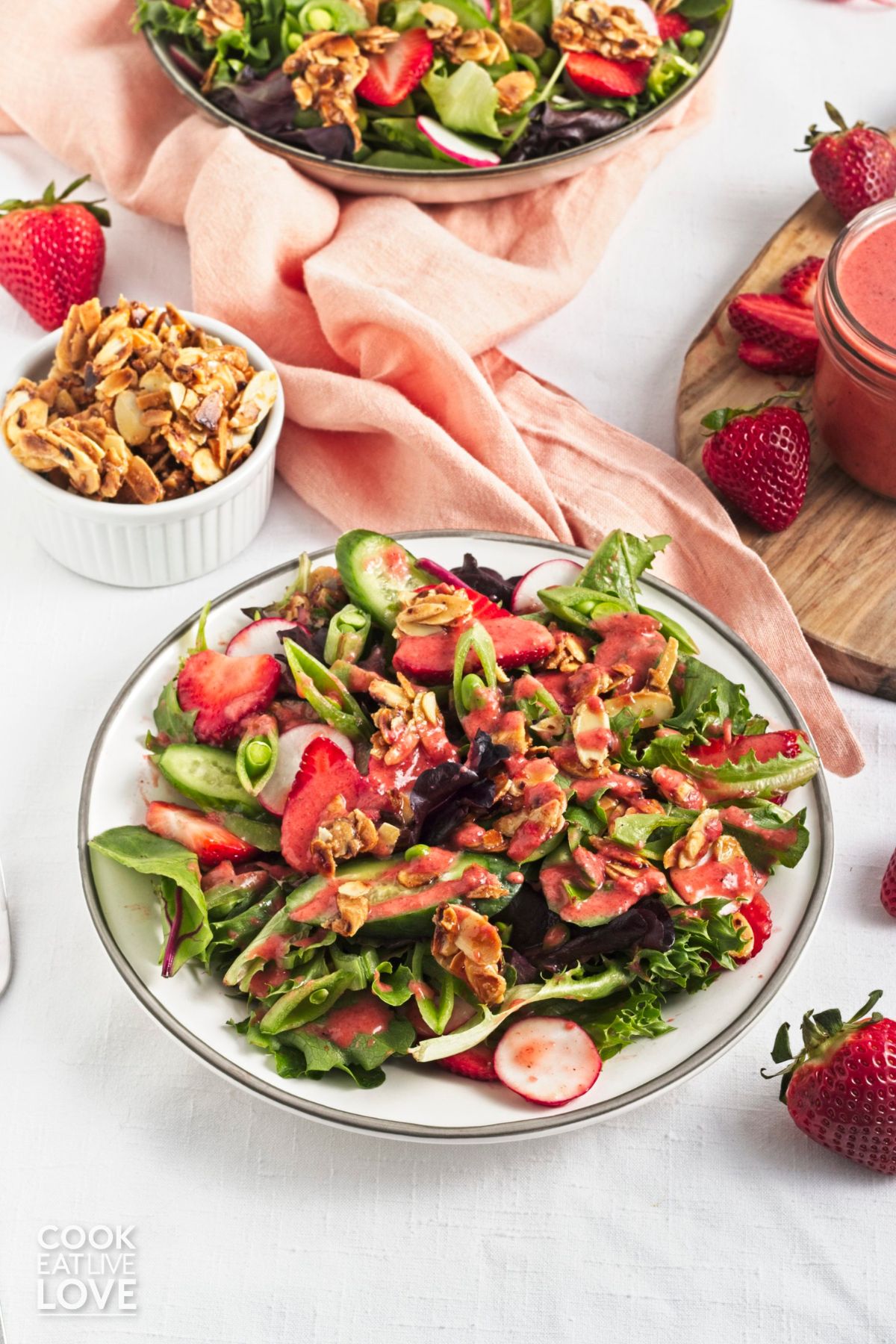A plate of summer strawberry salad on a table ready to eat. 