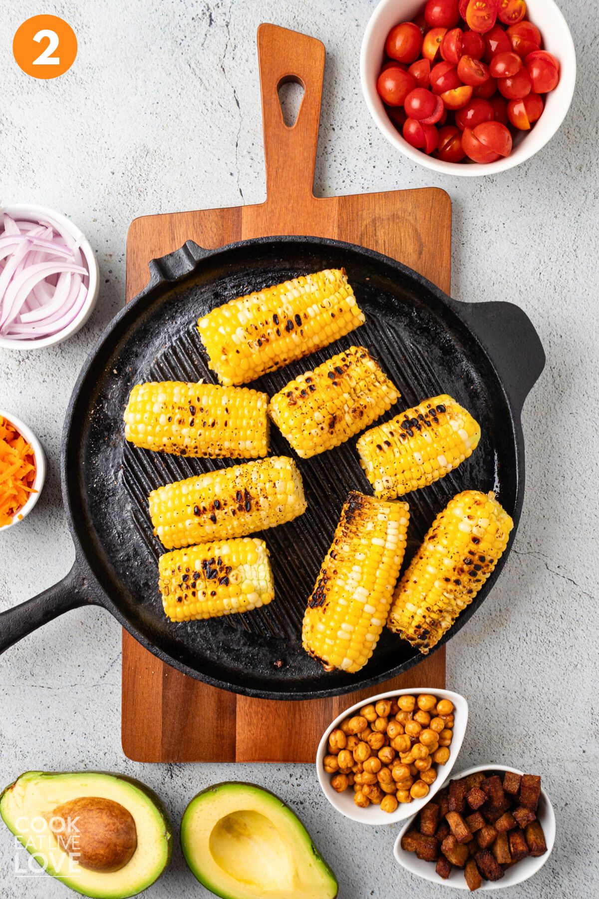 Cooking corn on a grill pan.
