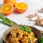 Pin for pinterest graphic with image of orange tofu and text on top.