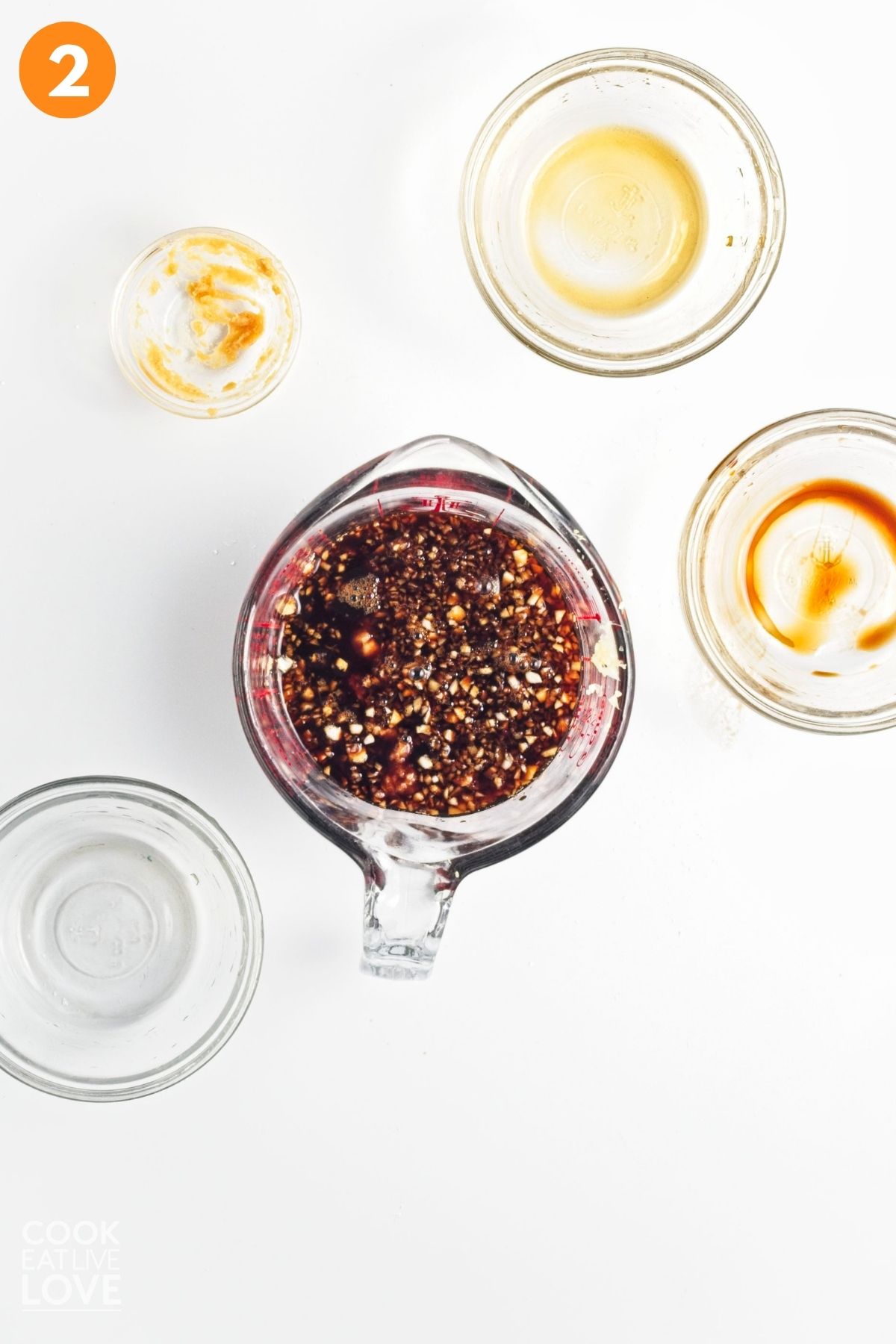 Sauce mixed in a glass measuring cup.