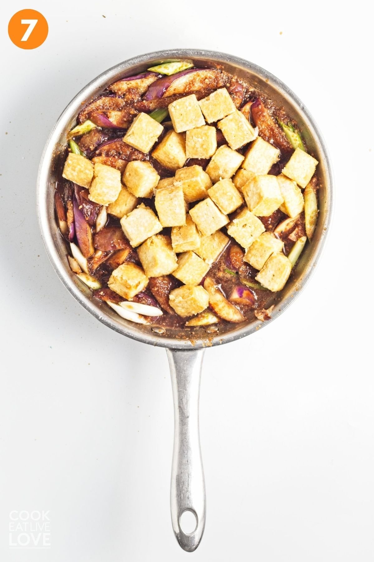 Tofu added to the skillet with the eggplant and sauce.