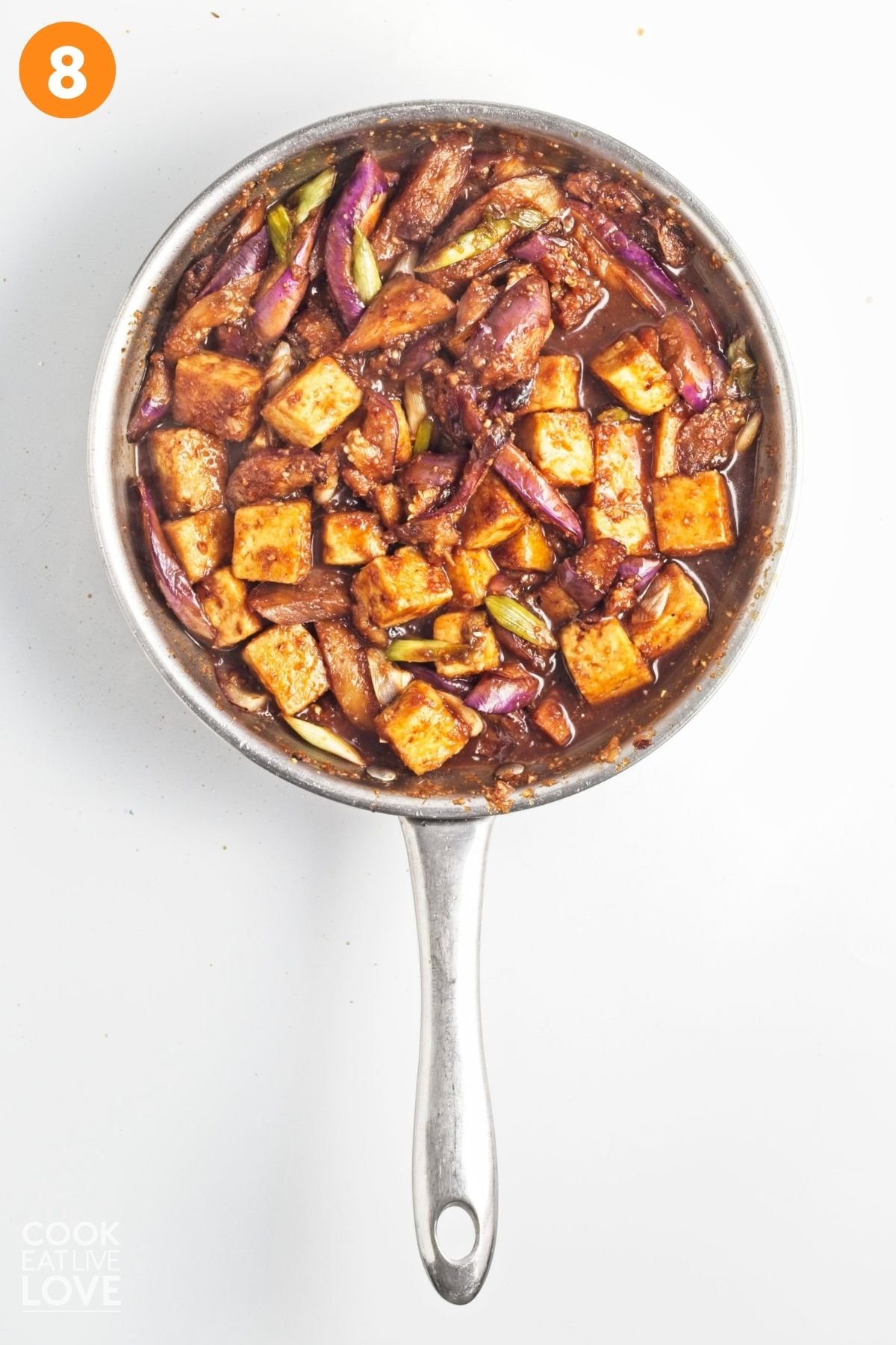 Tofu eggplant dish cooked in a skillet.