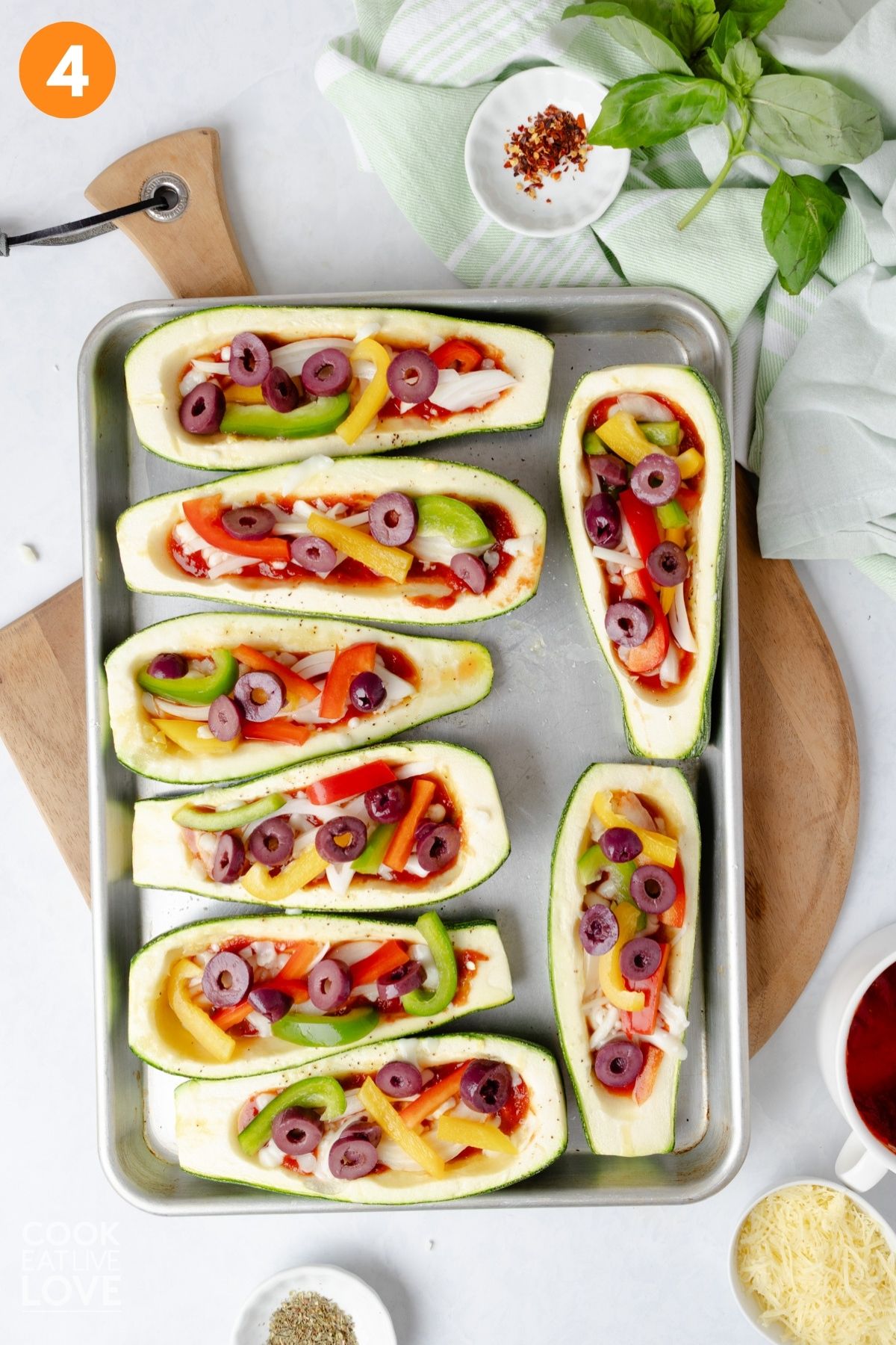 Vegetables added on top of the zucchini boats.
