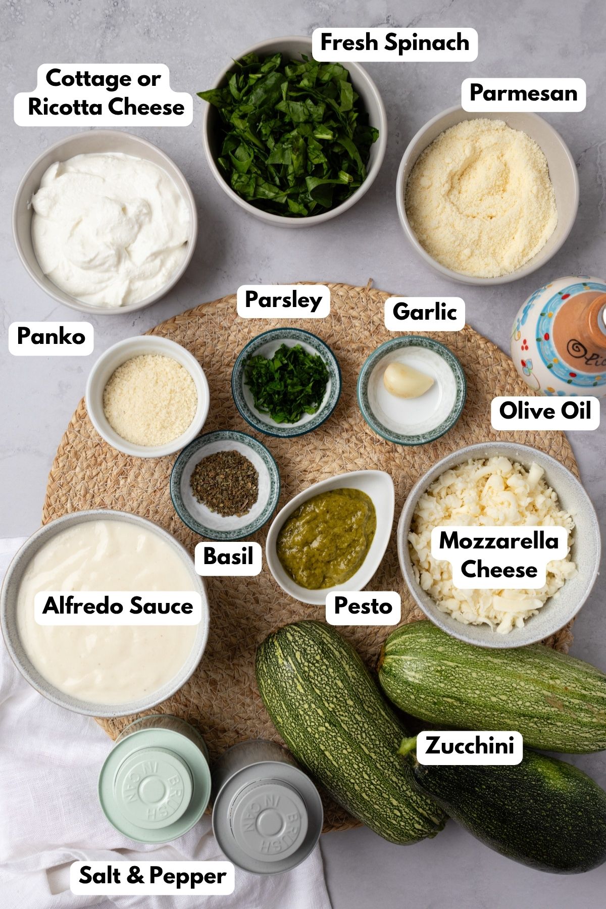 Ingredients to make zucchini rollatini with text labels to the side.