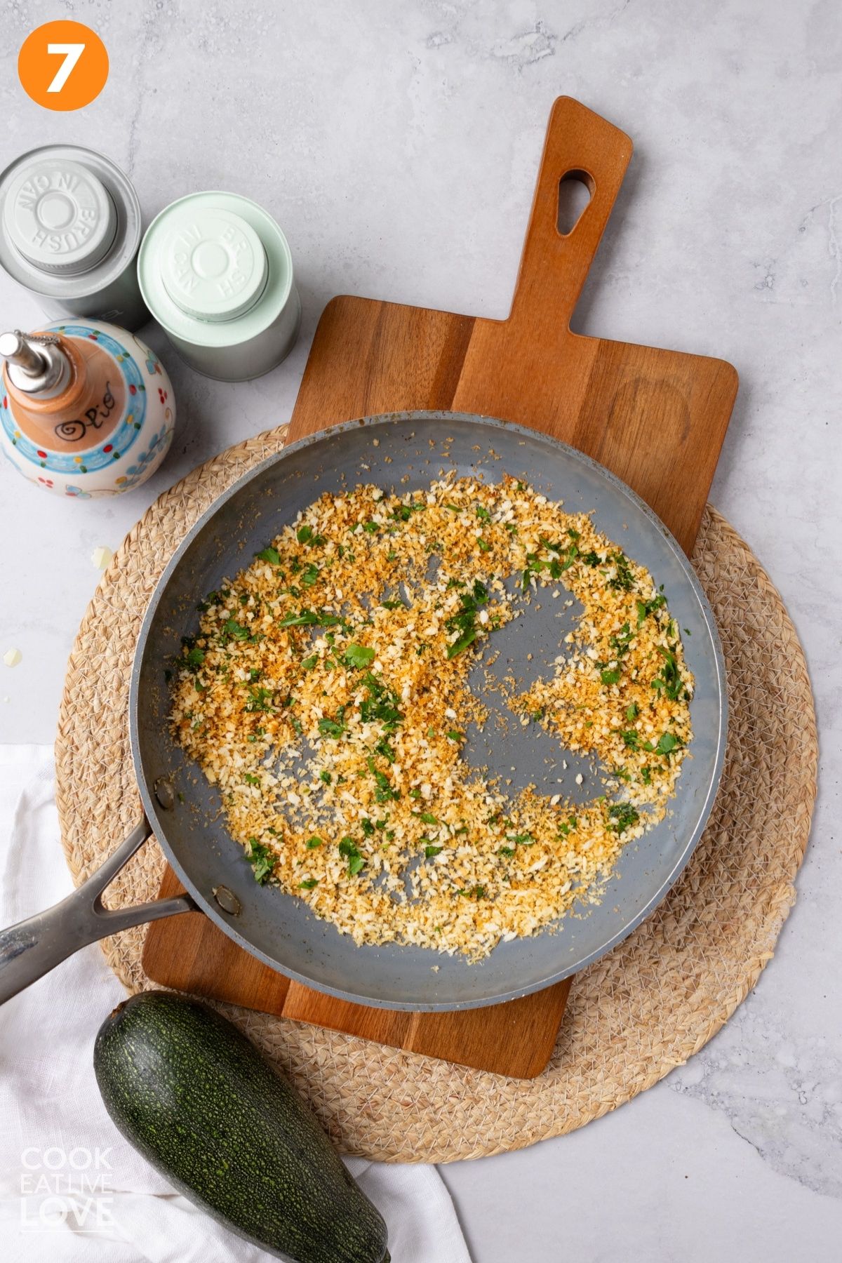 Panko toasted in a pan with parsley added.