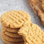 Pin for pinterest graphic with images of vegan peanut butter cookies with text on top.