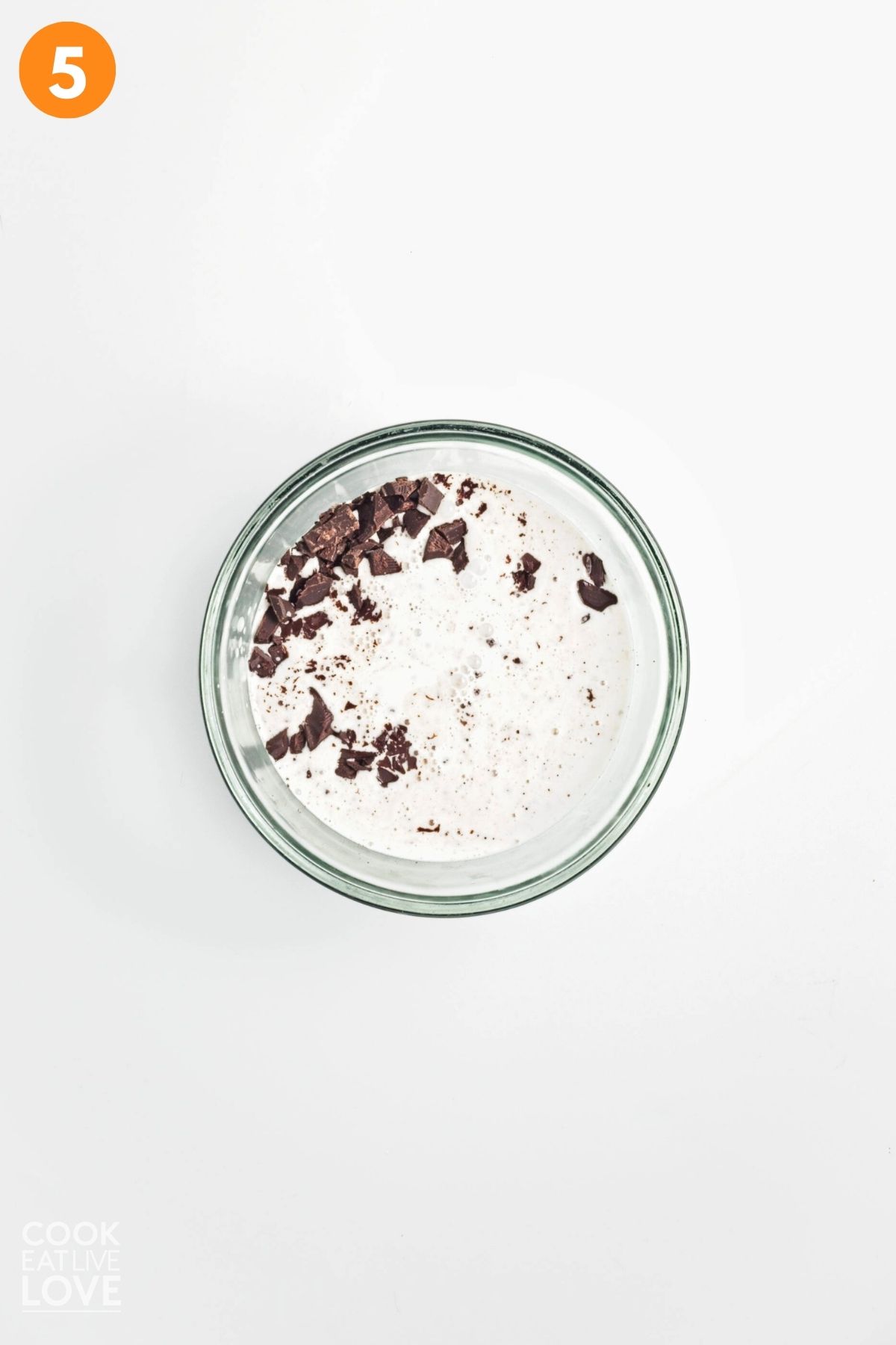Chocolate and coconut milk in a glass bowl.