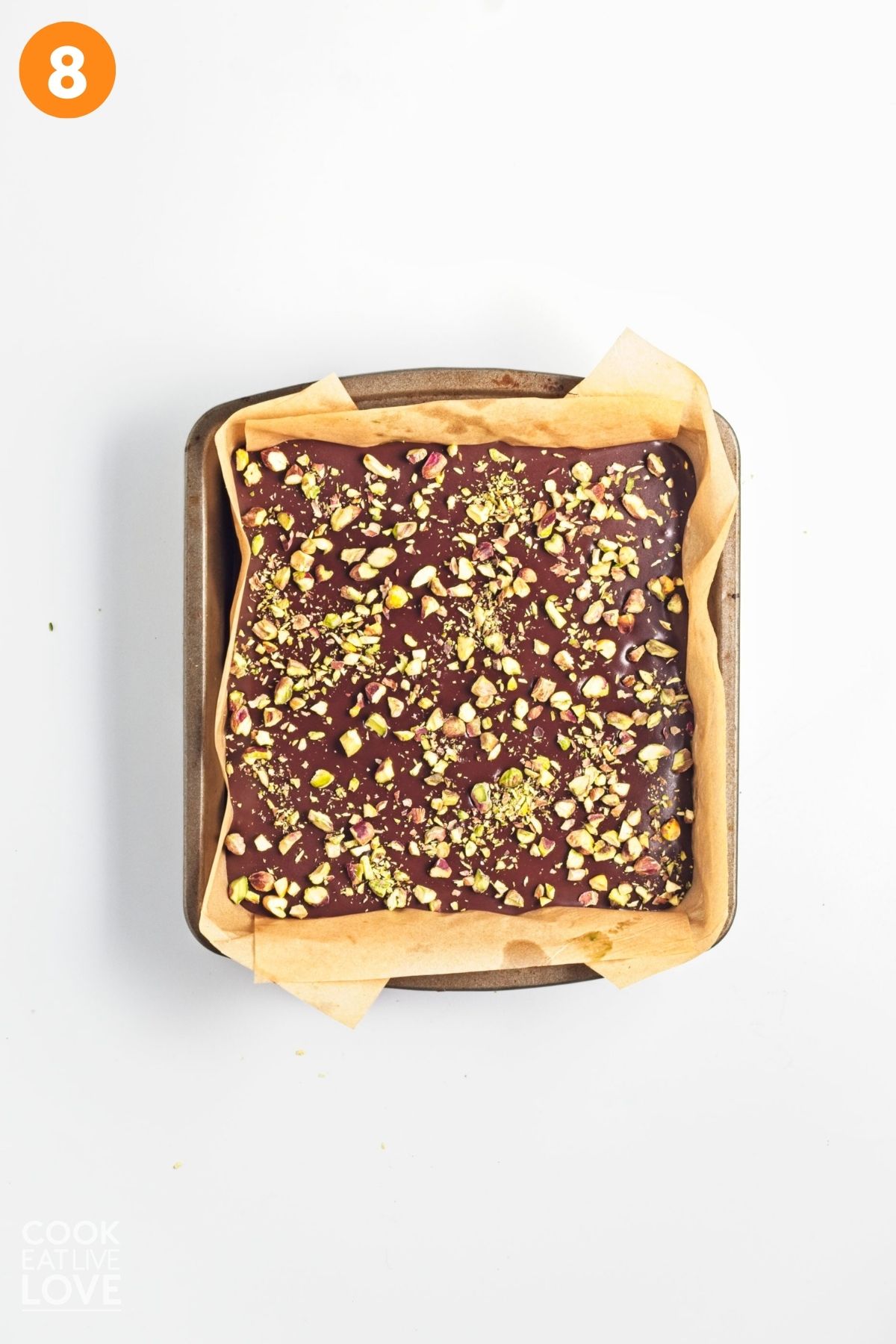 Pistachios sprinkled on top of the chocolate.