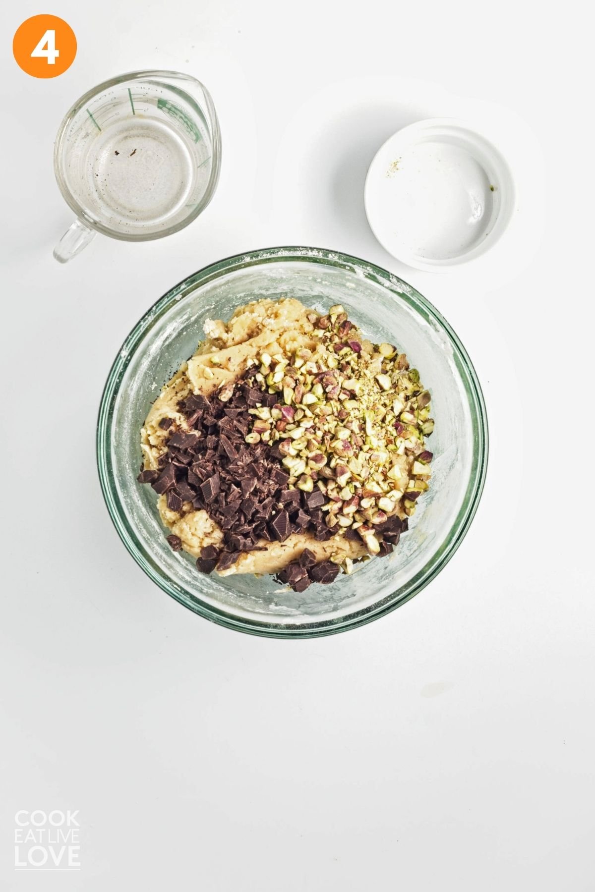 Pistachios and chocolate chunks added to cookie dough.