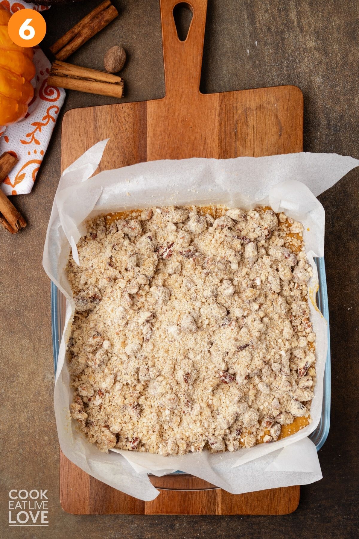 Streusel topping added on top of the pumpkin cake batter.