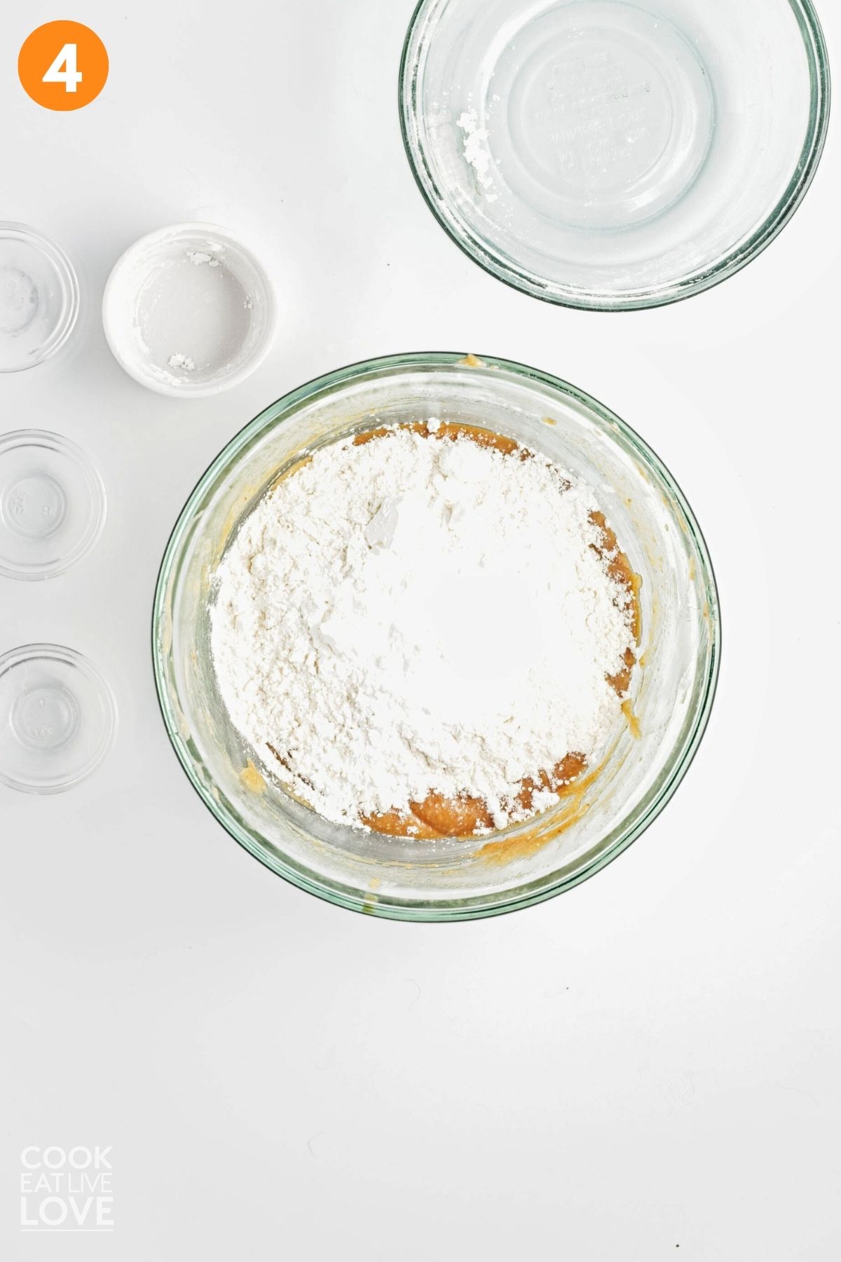 Flour added to the bowl to make the vegan peanut butter cookie dough.