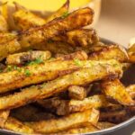 Pinterest graphic with baked fries image and text on top.