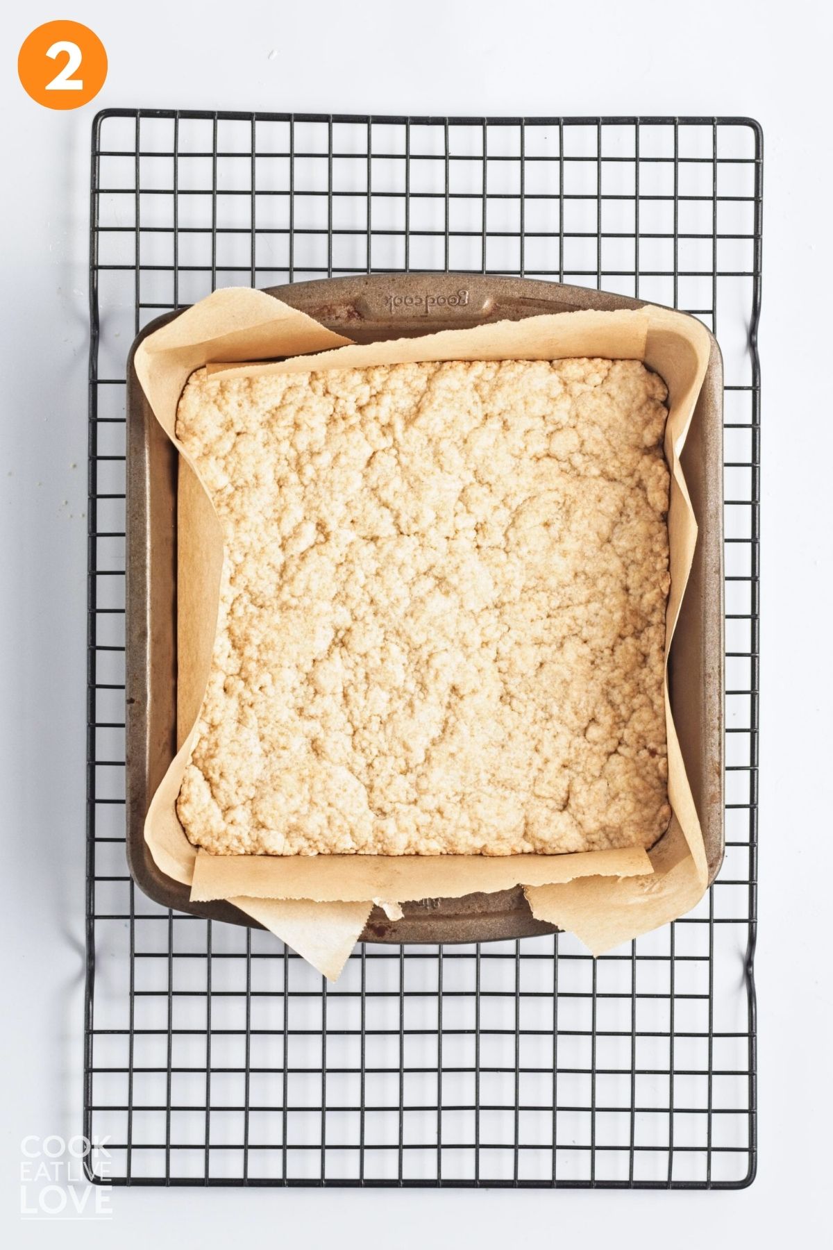 Crust pressed into a square baking pan.