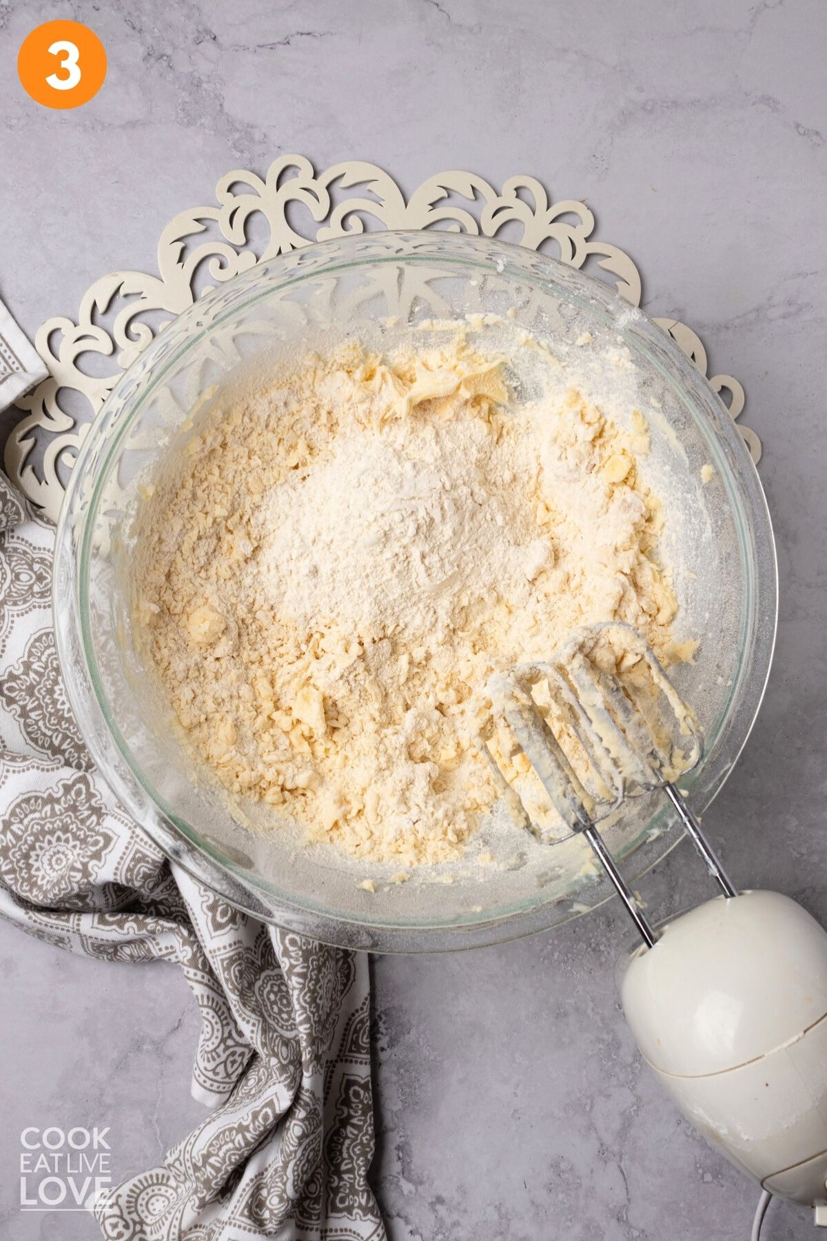 Flour added to the butter and sugar mixture. 