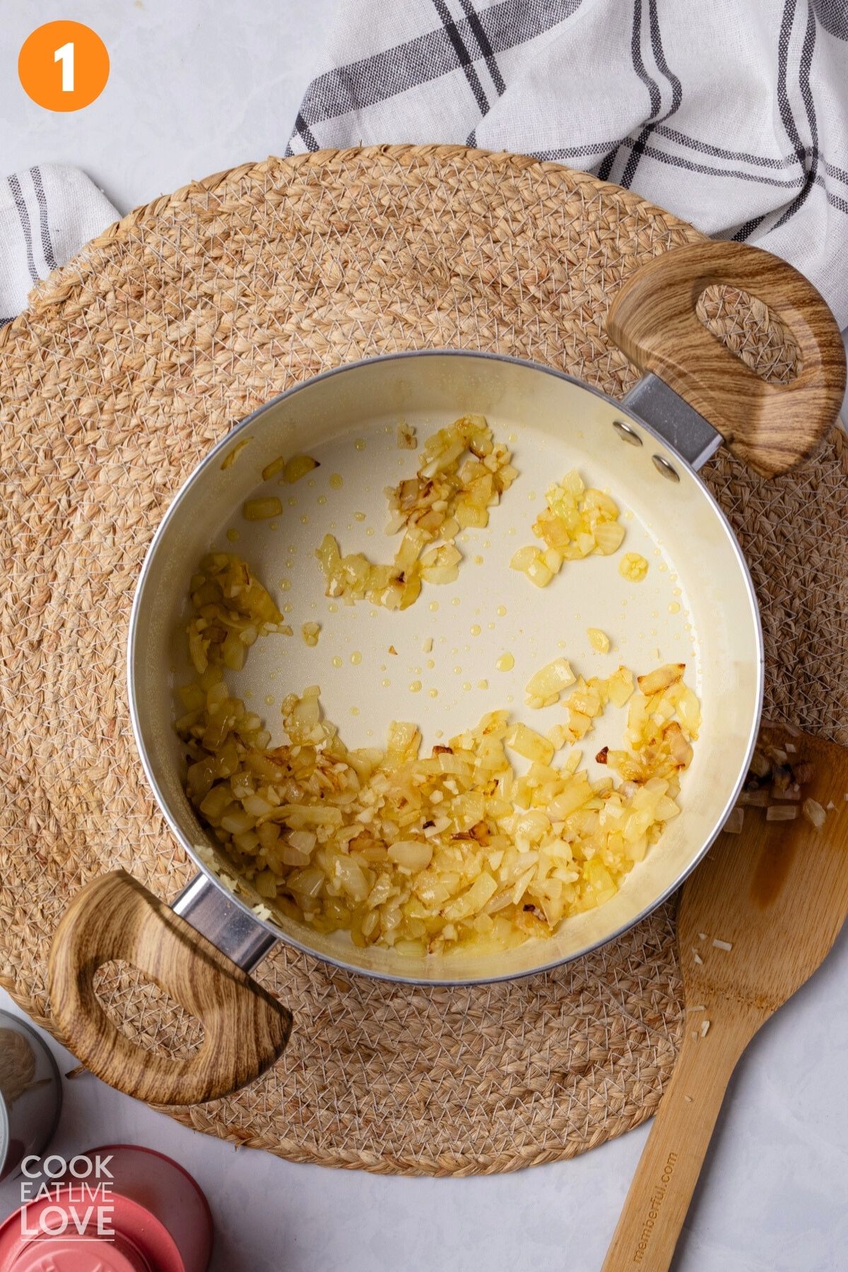 Onions cooked until tender in a pot.