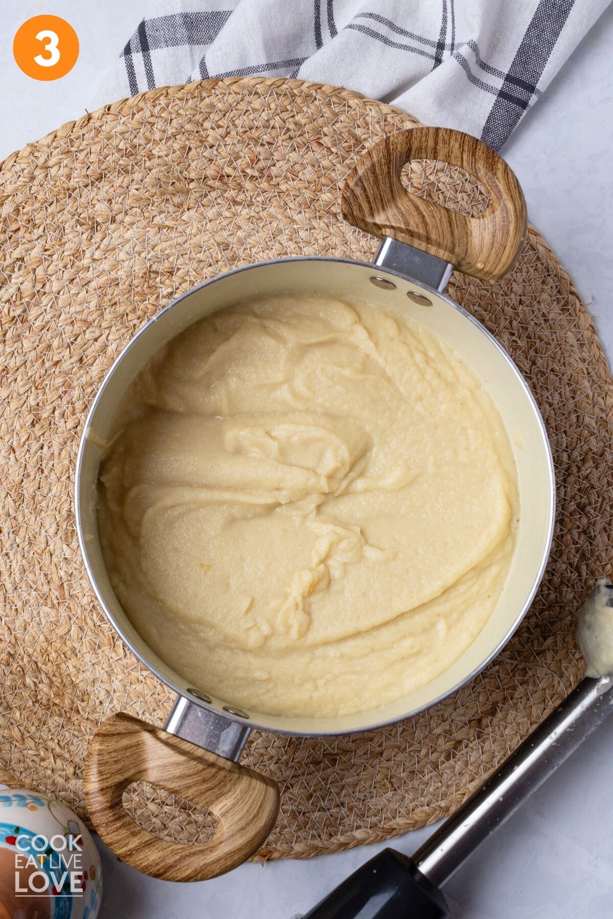 Sauce is blended in a pot. 