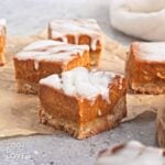 Vegan pumpkin bars on a piece of parchment.