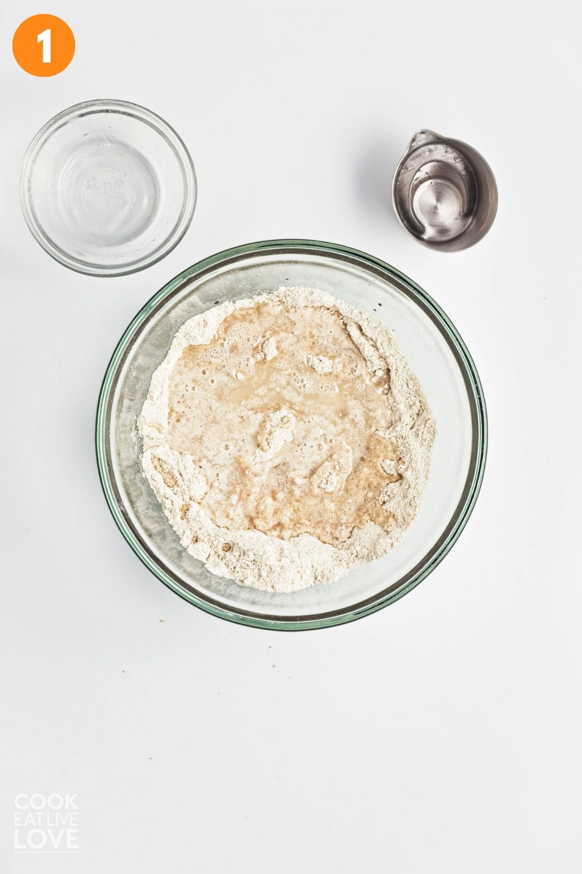 Ingredients to make a crust for pumpkin bars in a bowl.