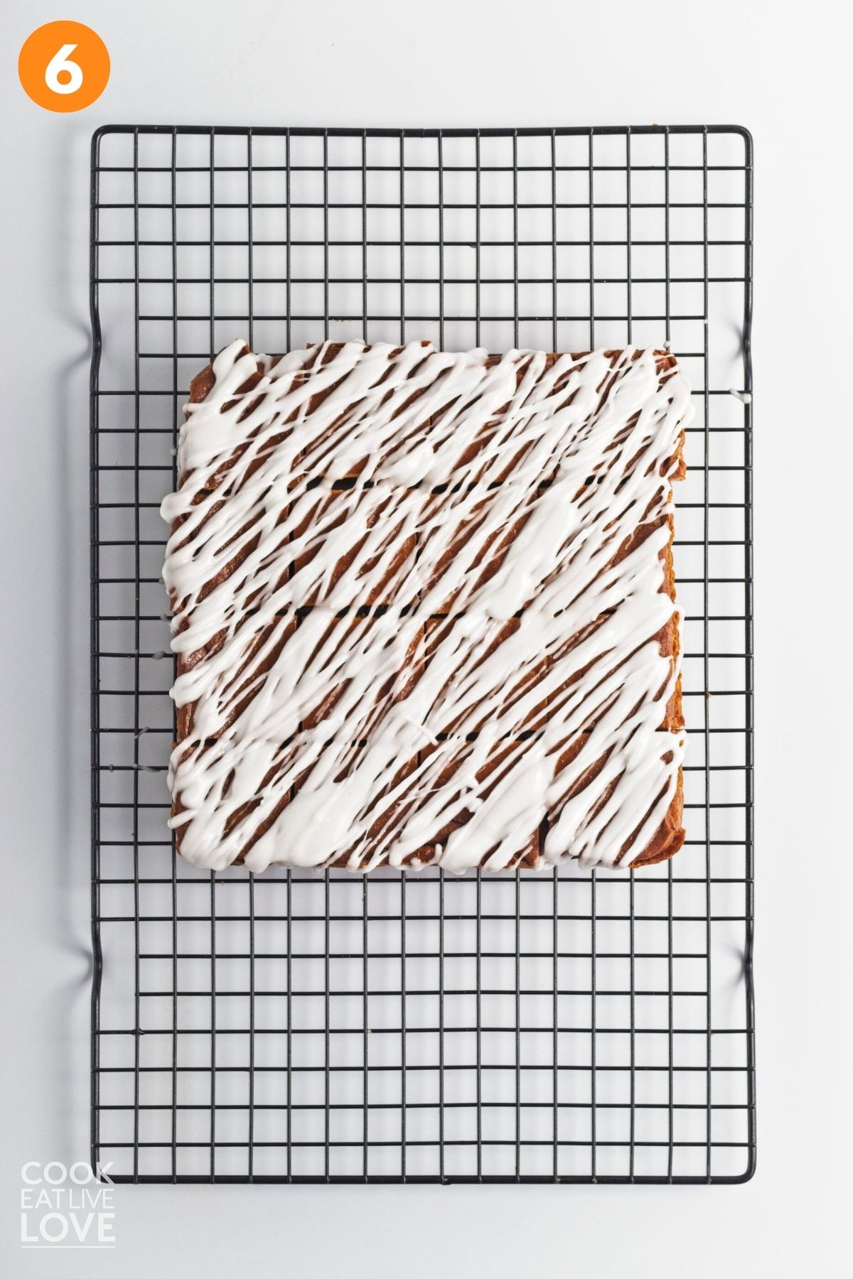 Glazed vegan pumpkin bars on a wire rack. 