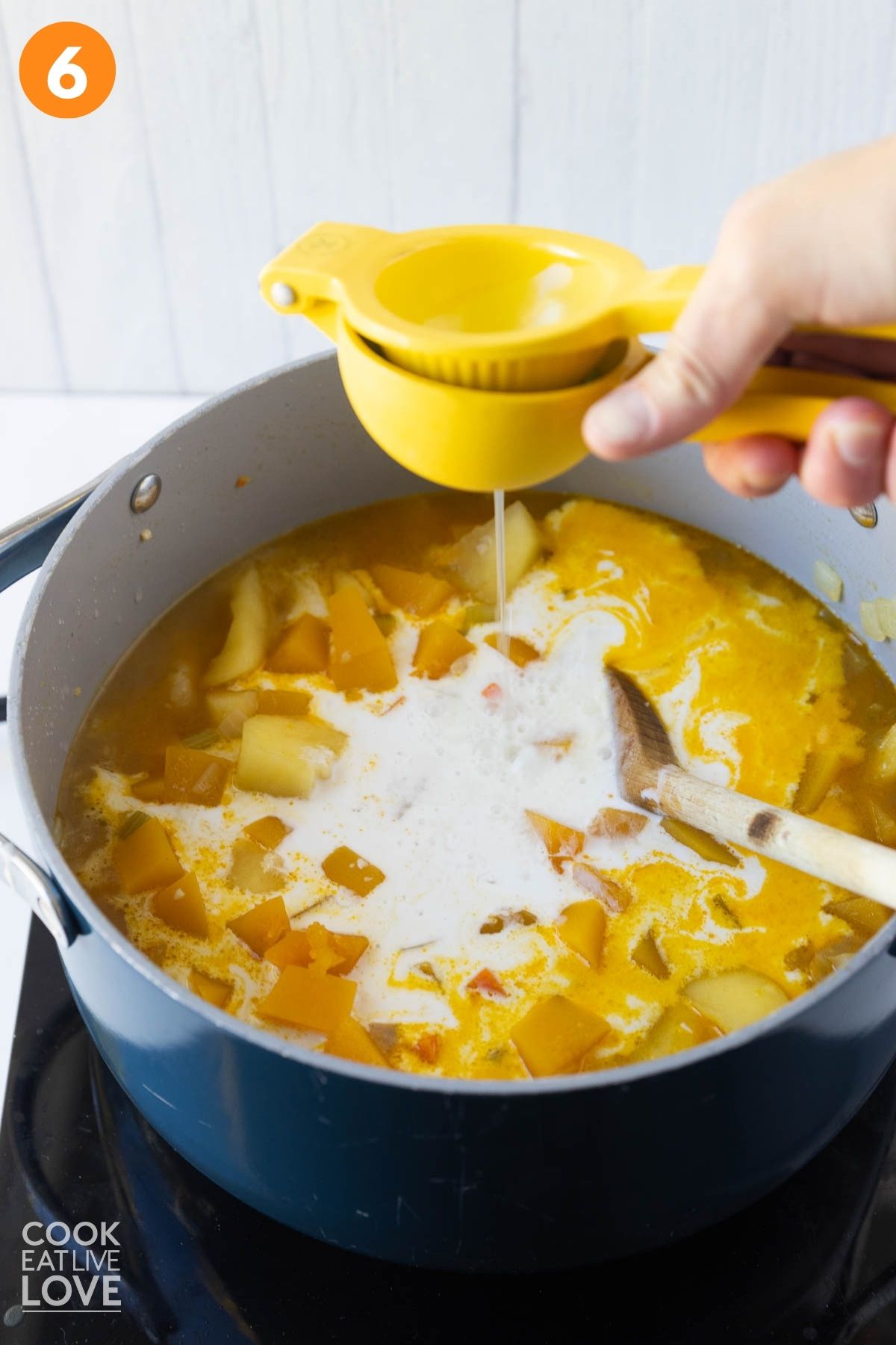 Squeezing in fresh lime juice.