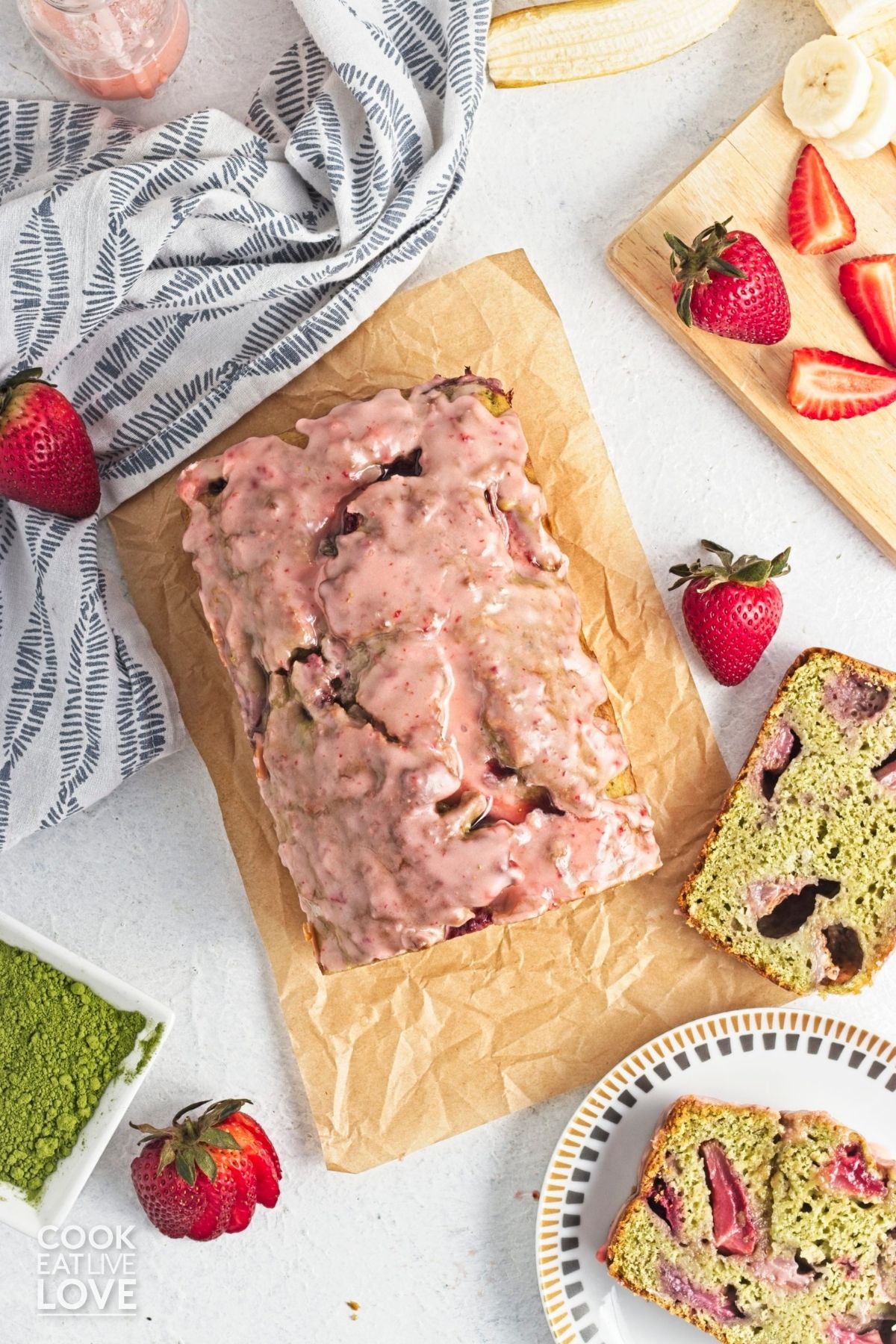 Matcha banana bread loaf with a slice to the side. 