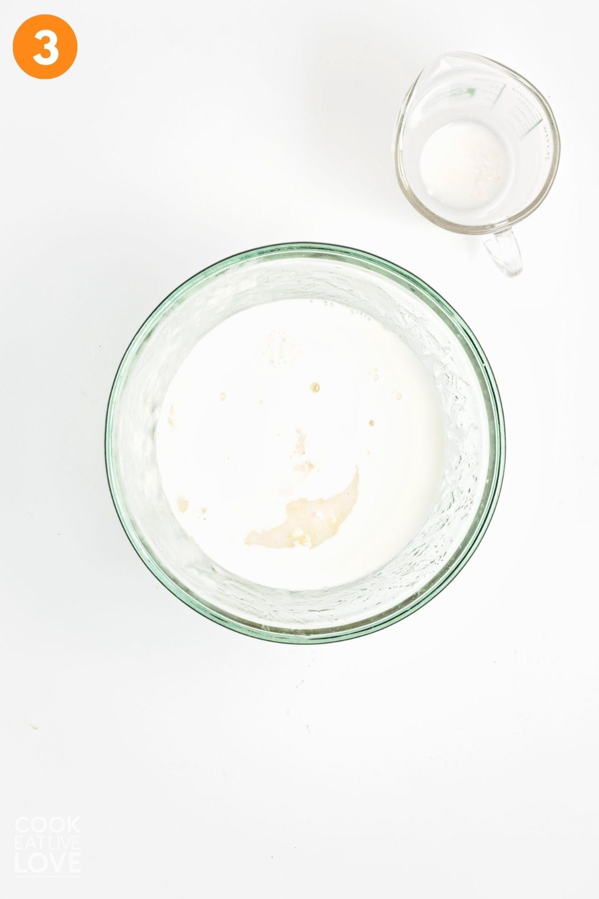 Wet ingredients added to a bowl to mix. 