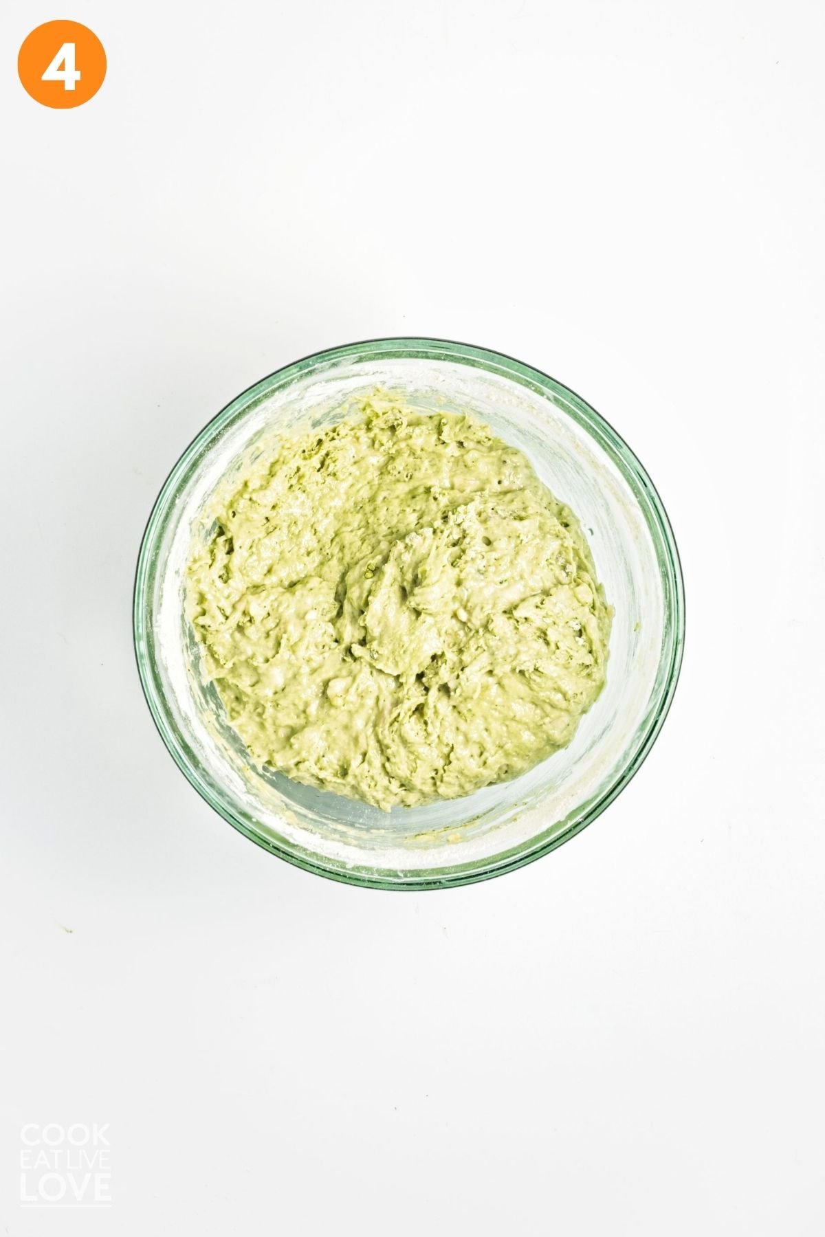 Matcha banana bread batter in a mixing bowl. 