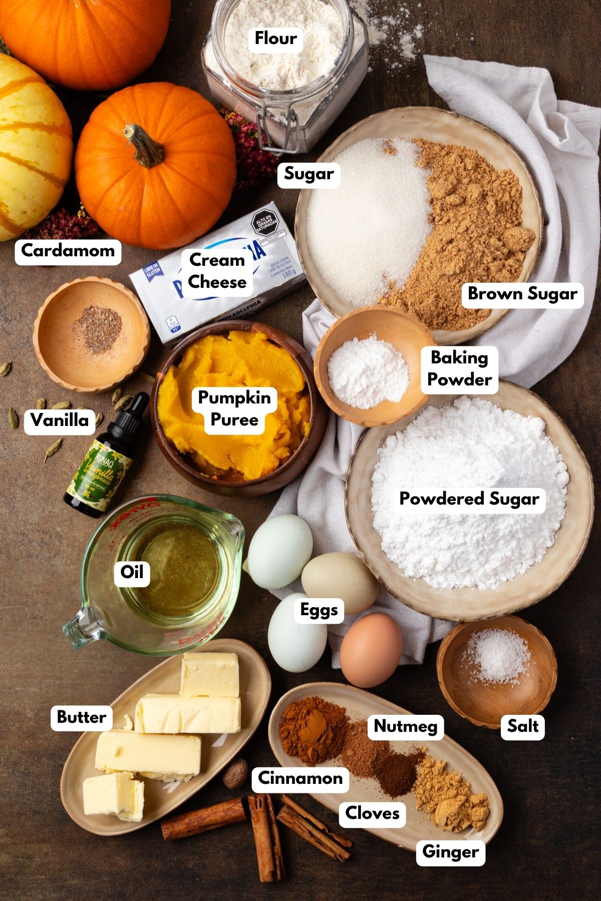Ingredients to make pumpkin sheet cake on the table before mixing. 