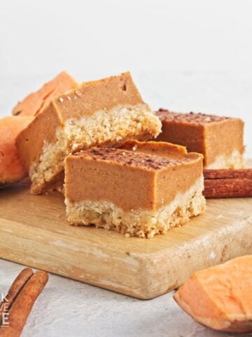 Sweet potato bars on a wooden cutting board.