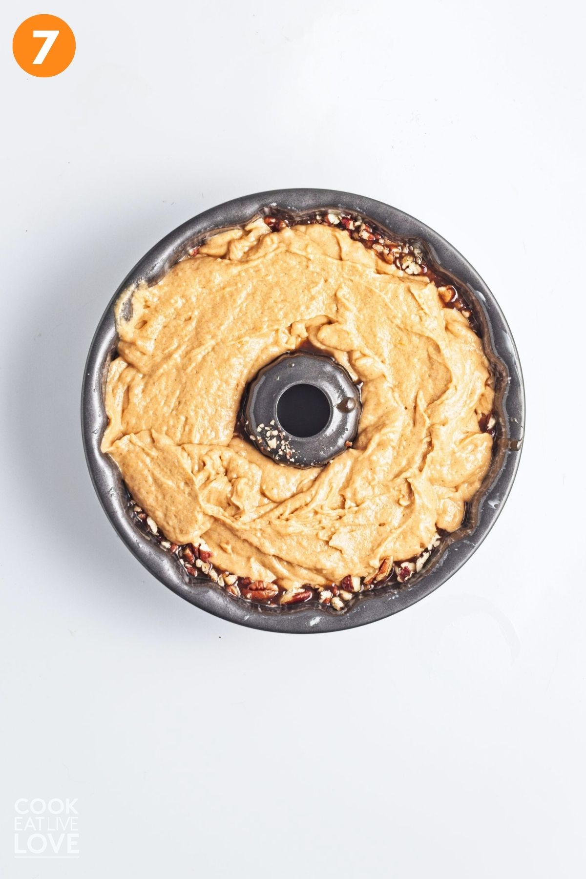 Sweet potato bundt cake batter poured into a bundt pan. 