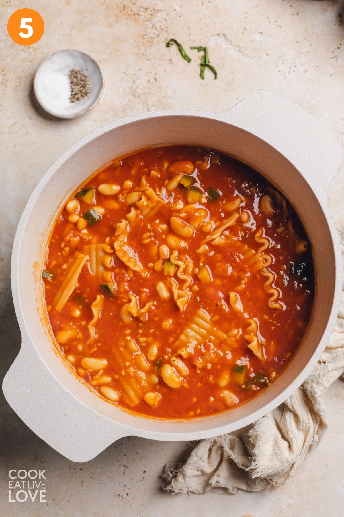 Vegan lasagna soup cooking in a pot.
