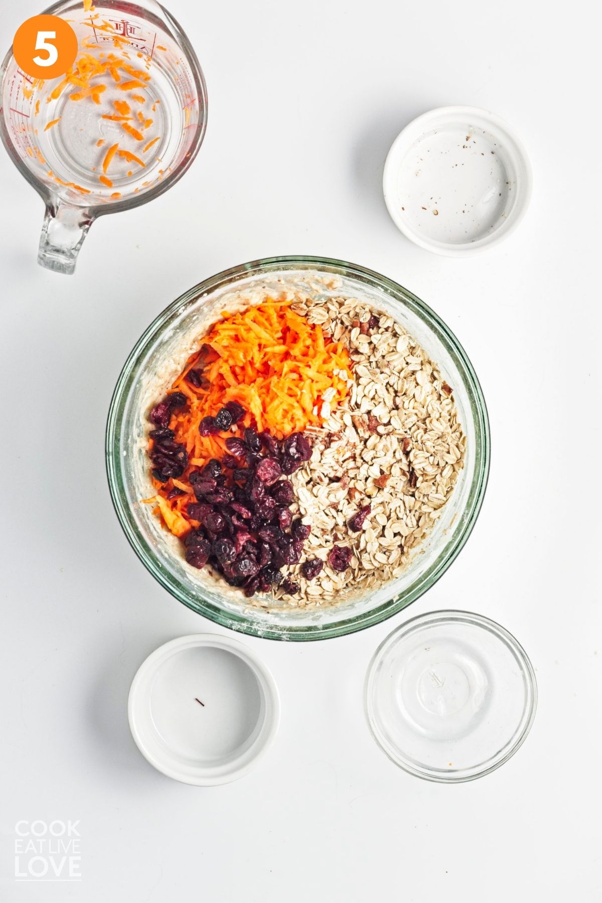 Carrots, cranberries, and pecans added to the muffin batter.