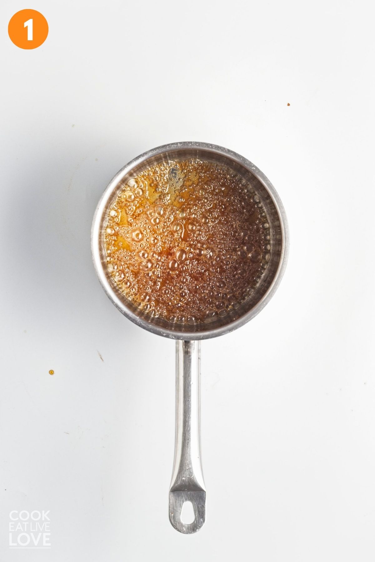 Sugar boiling in a saucepan. 