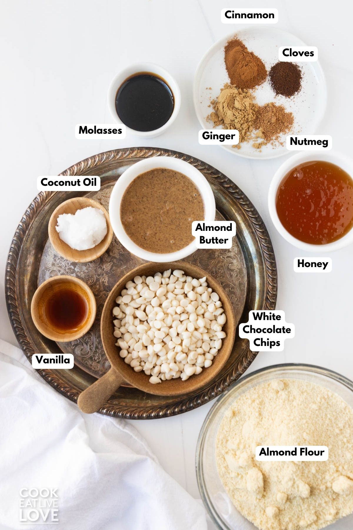 Ingredients to make gingerbread truffles in bowls on a table.
