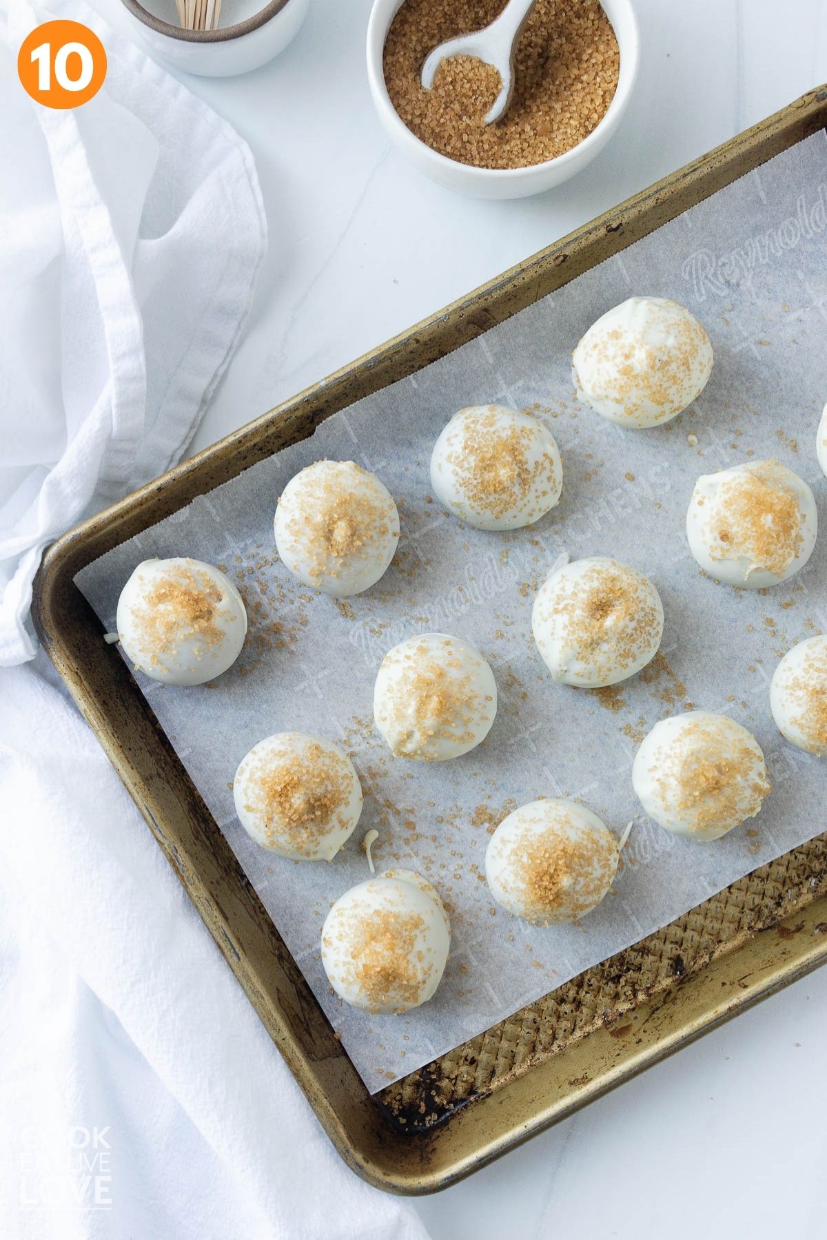 Topping added to the truffle on a parchment lined tray.