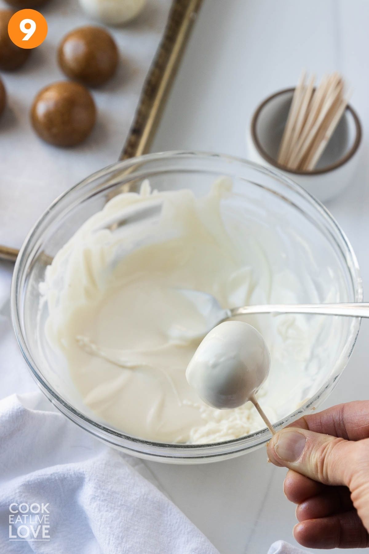 Each truffle stabbed with a toothpick.