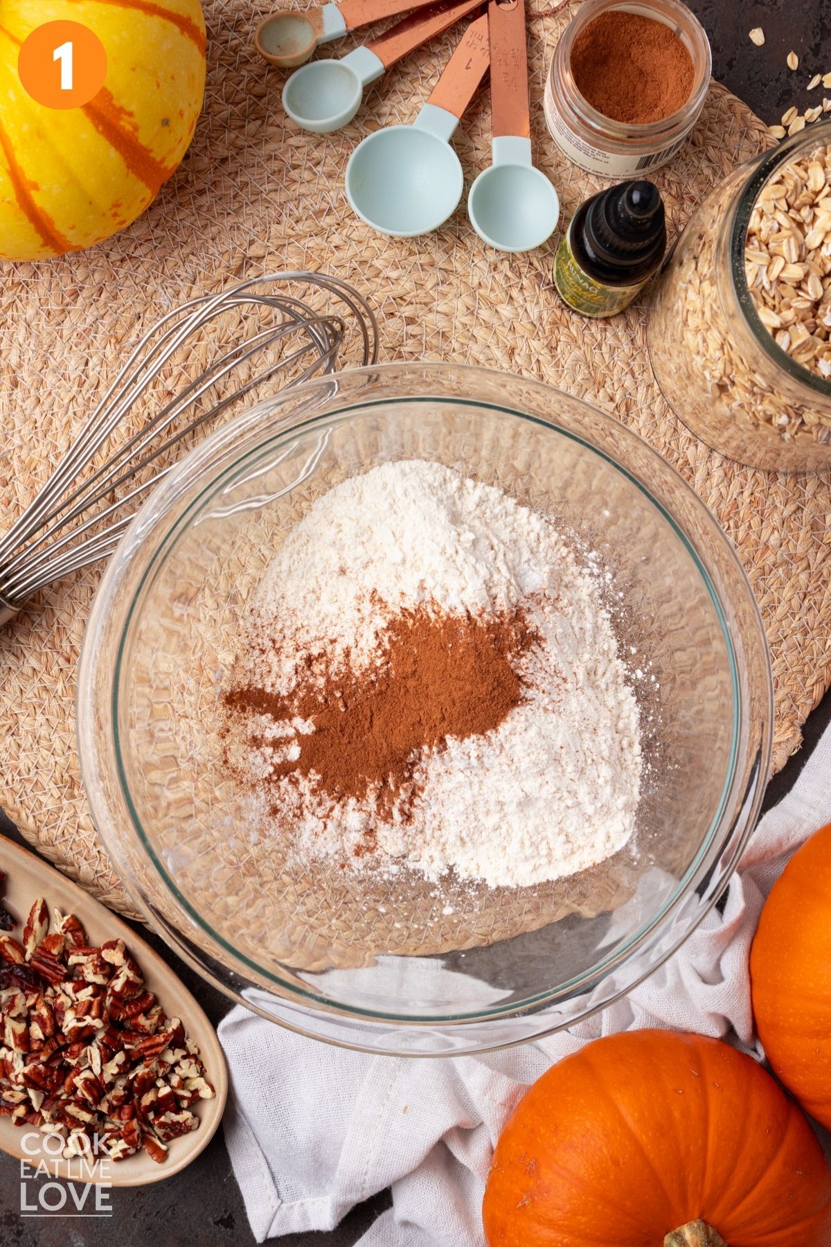 Flour, cornstarch, baking soda, cream of tartar, baking powder, salt, and cinnamon in a bowl.