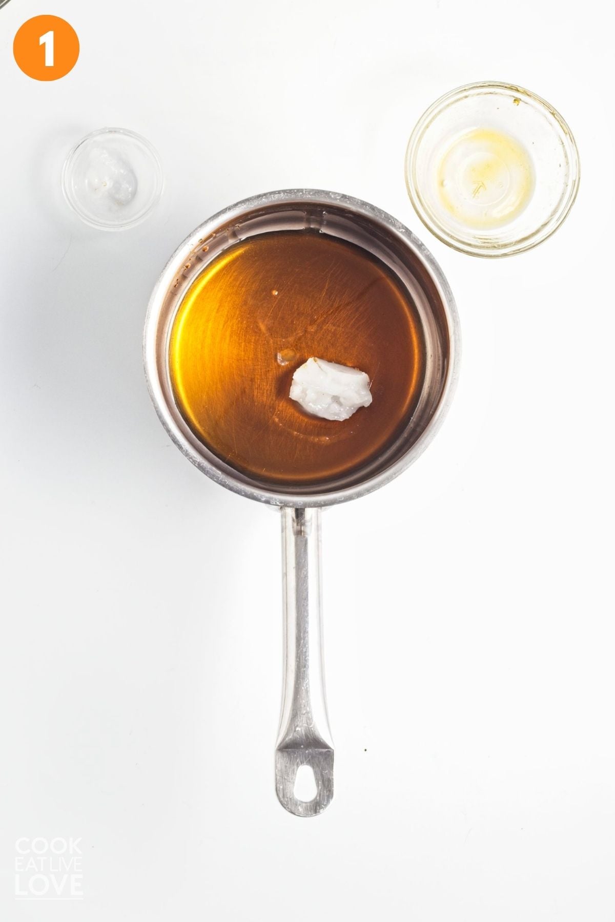 Heating the coconut oil and syrup in a saucepan. 