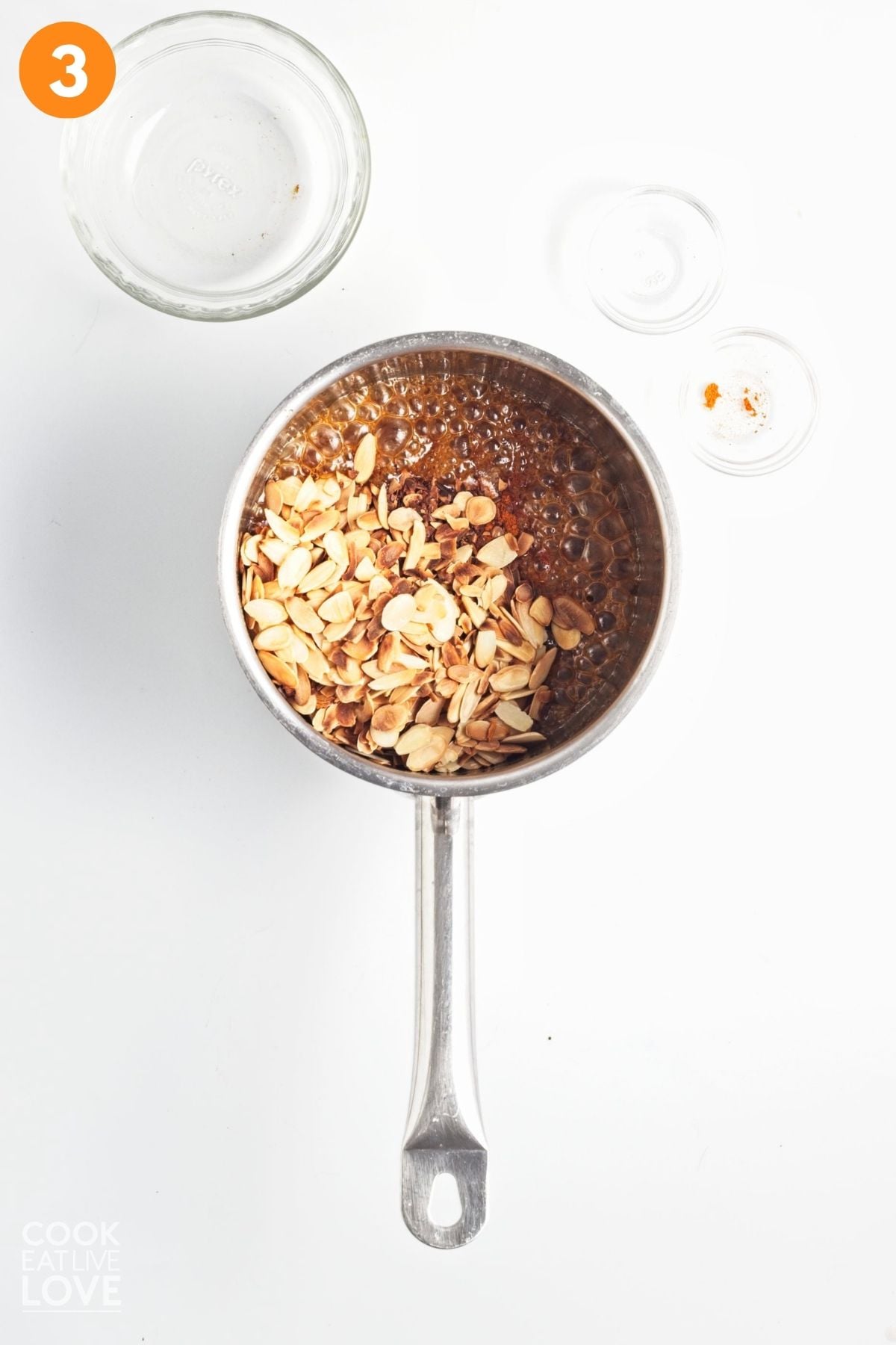 Almonds added to the saucepan. 