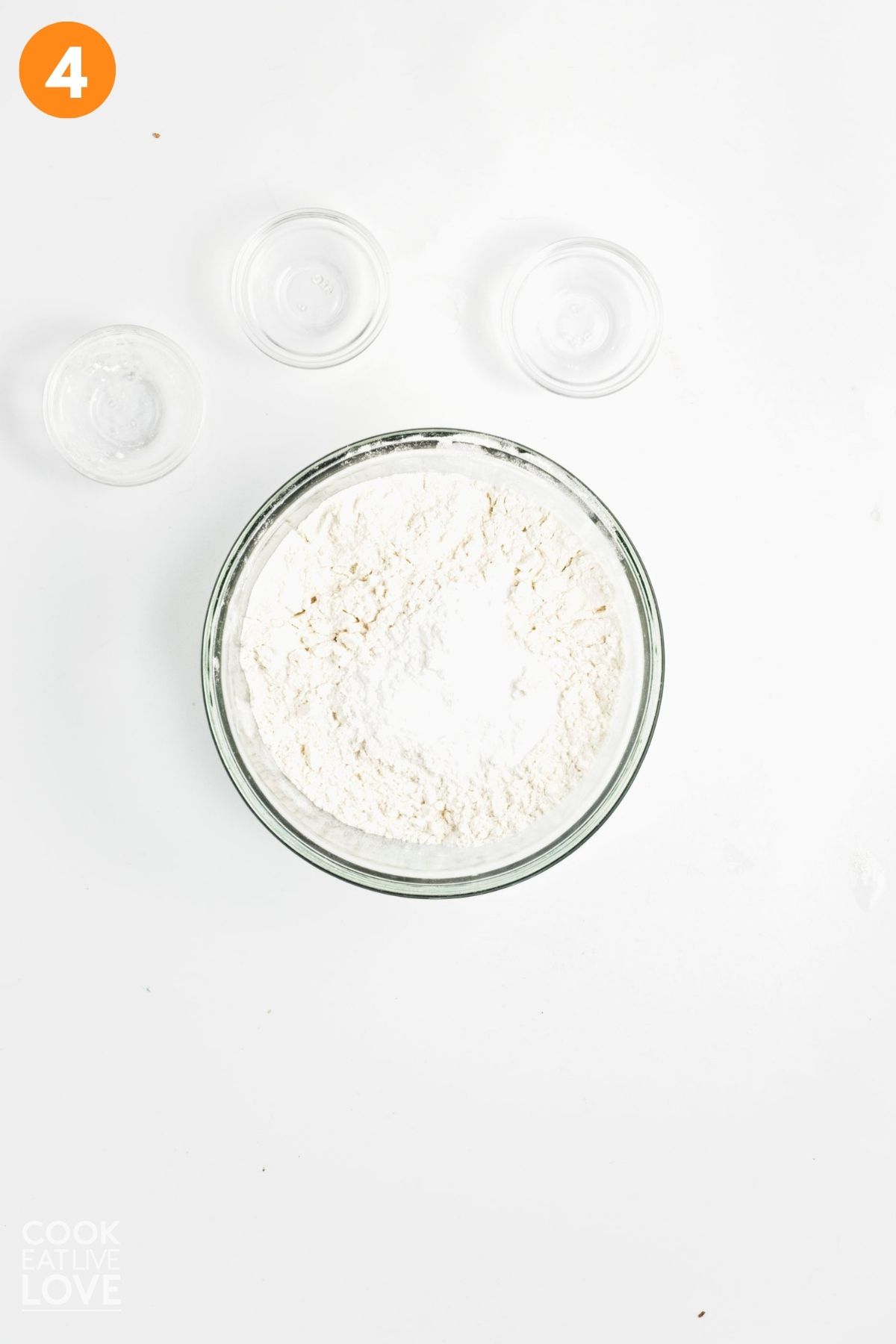 The flour, baking powder, baking soda, and salt in a mixing bowl.