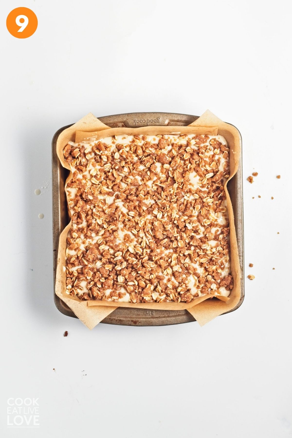 Oat streusel spread over the top of the batter.