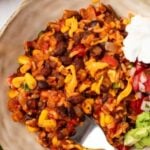 Pinterest graphic with image of taco rice and text on top.